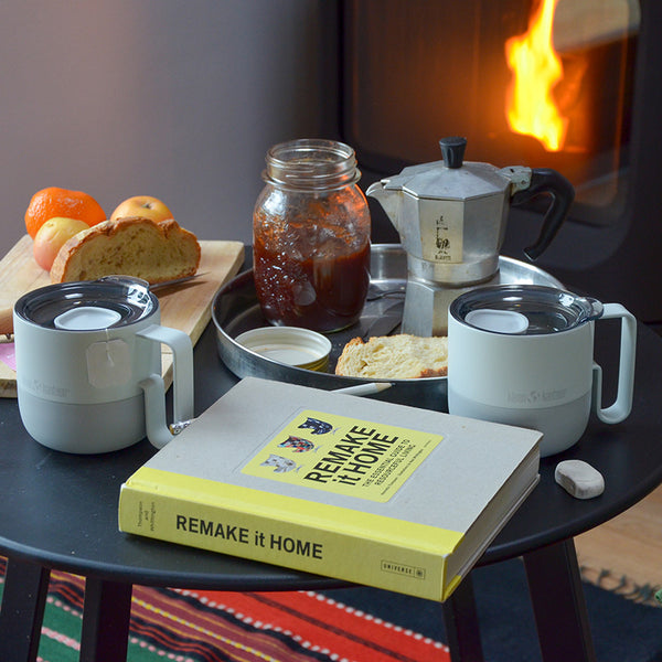 12oz_rise_coffee_mug_barely_blue_table_woodstove_square_600x.jpg