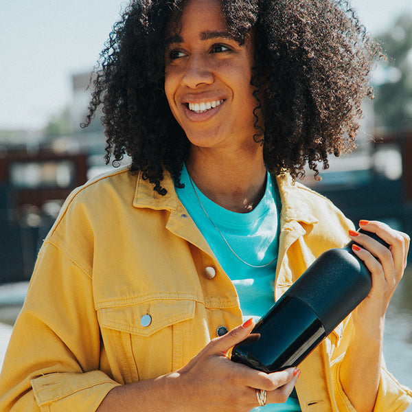 20oz_rise_classic_insulated_bottle_black_woman_smile_square_600x.jpg