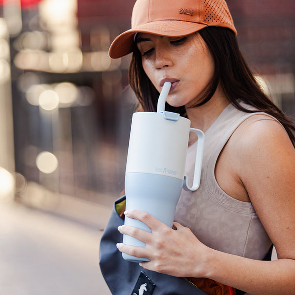 36oz_rise_tumbler_straw_girl_sip_square_600x.jpg